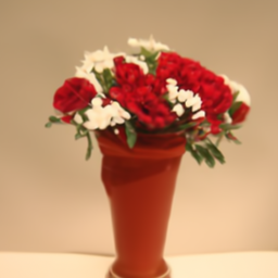 A pale green vase containing red and white flowers (failure case)